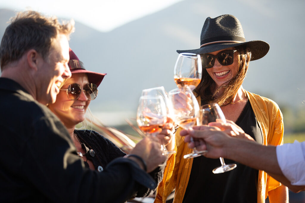 People toasting glasses of wine at Brick Barn Wine Estate