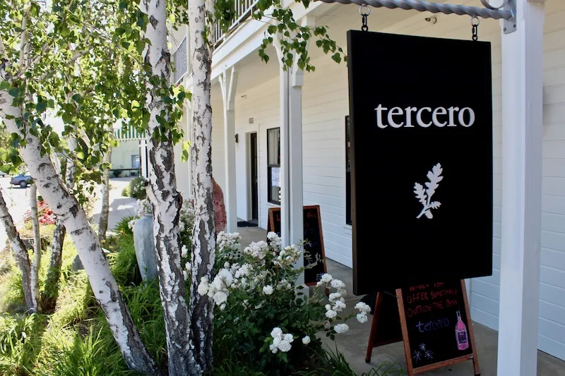 Sign and trees at Tercero wine tasting room in Los Olivos California