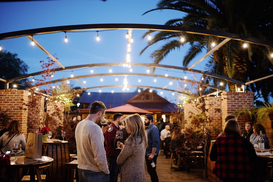 People under the night sky enjoying wine and music at Carhartt Family Wines